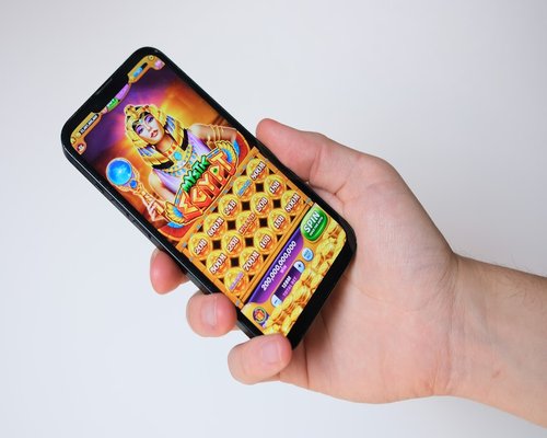 Smartphone showing the fictional Crown Level Rush arcade game