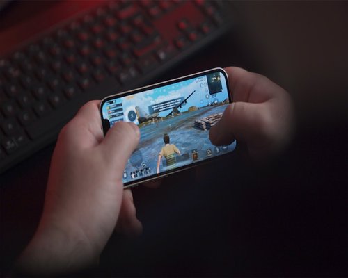 Angled smartphone showing the fictional Outback Signal Path puzzle game