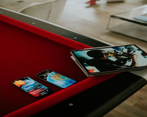 Angled smartphone showing the fictional Coral Step Adventure mobile game